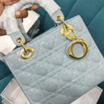 Medium size handbag with long belt patent article